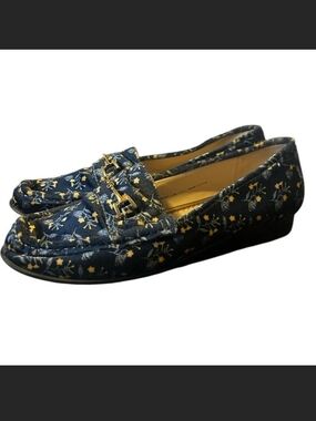 Cabi navy slip-on loafers with a small floral print. Gold-tone buckle accent